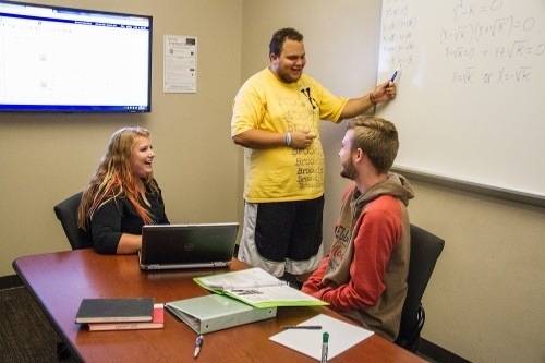 Students in a Group Study Room in the Mathewson-IGT Knowledge Center